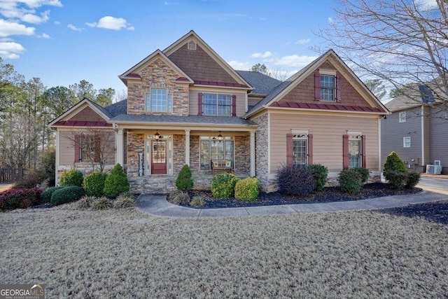 craftsman-style house with central AC unit and covered porch