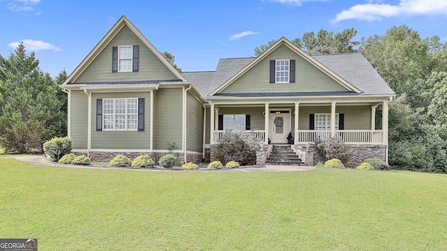 view of front facade with a porch and a front lawn