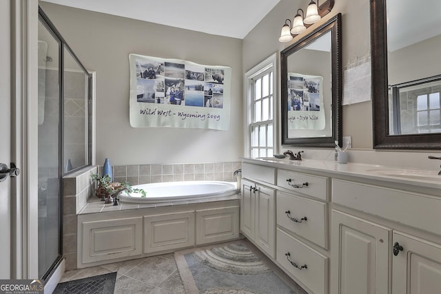 bathroom featuring vanity, shower with separate bathtub, and tile patterned floors