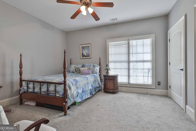 bedroom featuring light carpet and ceiling fan