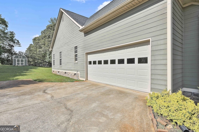 view of side of home with a garage and a lawn