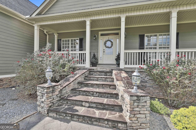 doorway to property featuring covered porch