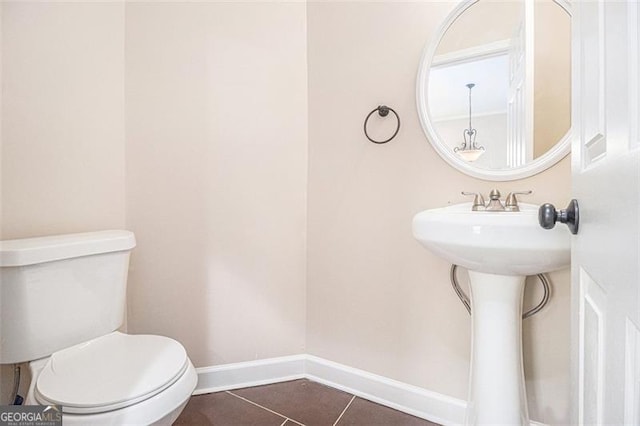 bathroom featuring tile patterned flooring and toilet