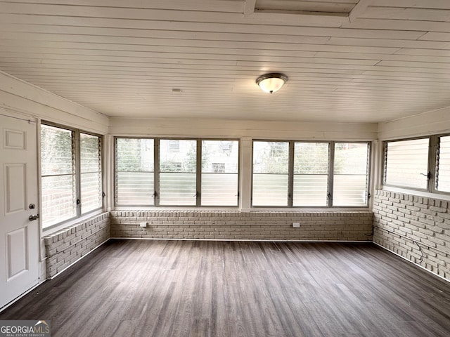 unfurnished sunroom with plenty of natural light and wooden ceiling