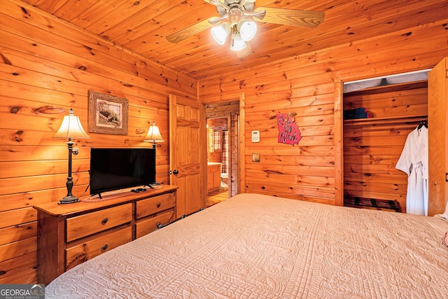 bedroom featuring ensuite bath and wood ceiling