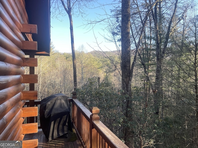 deck featuring a view of trees