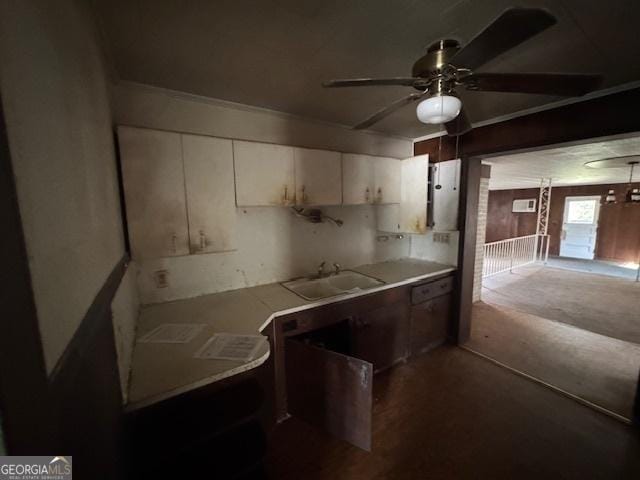 kitchen featuring ceiling fan, dishwasher, and sink