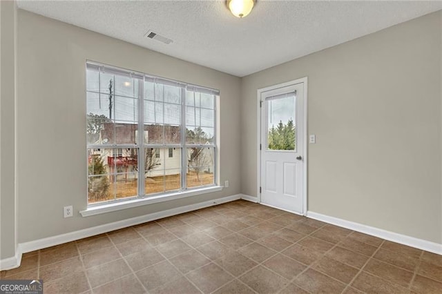 interior space with a textured ceiling