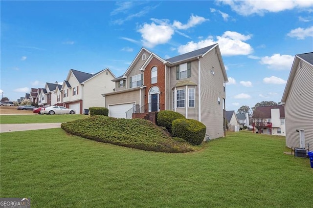 view of front of property with a garage and a front yard