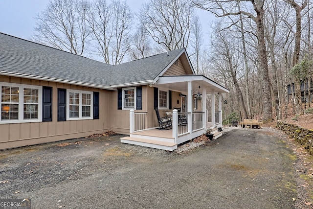 view of property exterior featuring covered porch