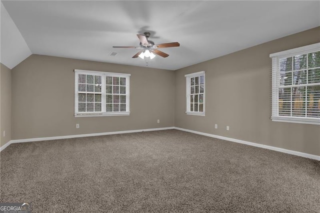 unfurnished room with lofted ceiling, carpet flooring, and ceiling fan