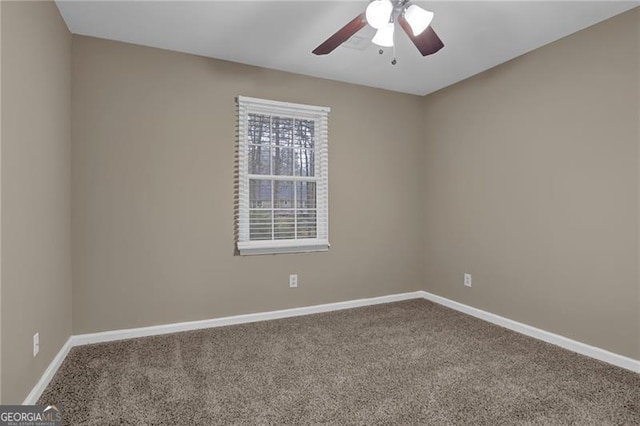 spare room featuring carpet floors and ceiling fan