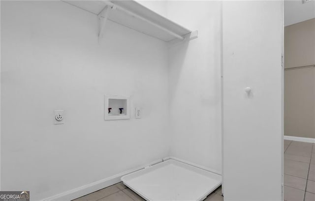 laundry room featuring hookup for an electric dryer, washer hookup, and light tile patterned floors