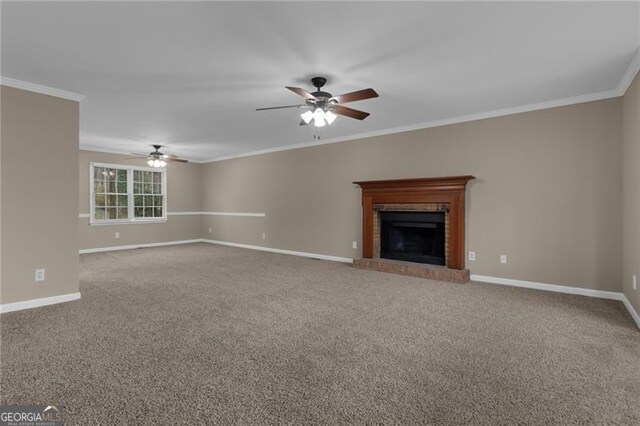 unfurnished living room featuring ornamental molding and carpet flooring