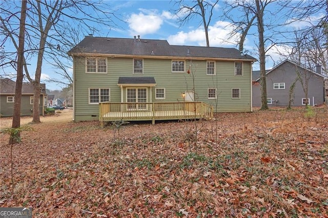 rear view of property featuring a deck