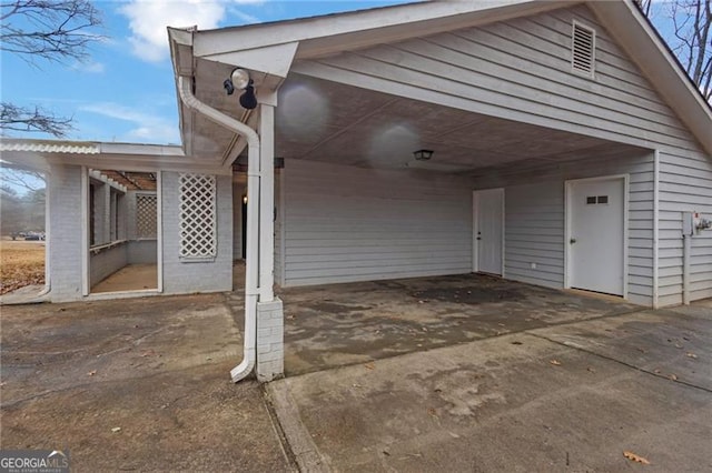 exterior space with a carport