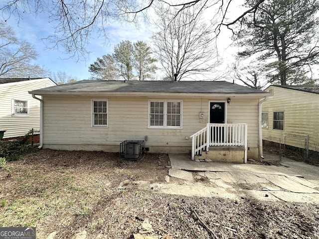 back of property featuring central AC unit