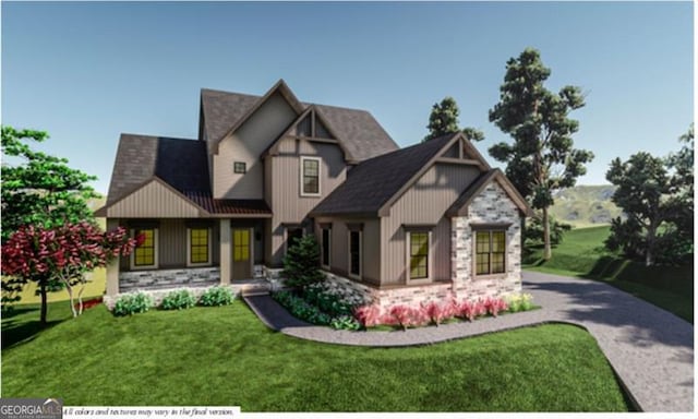 view of front of house with a front yard, stone siding, and board and batten siding