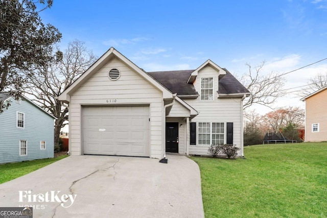 view of front of home with a garage and a front yard