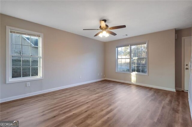 unfurnished bedroom with ensuite bath, a textured ceiling, ceiling fan, and carpet