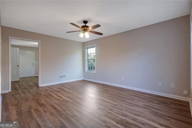 bathroom featuring vanity, a textured ceiling, wood-type flooring, and toilet