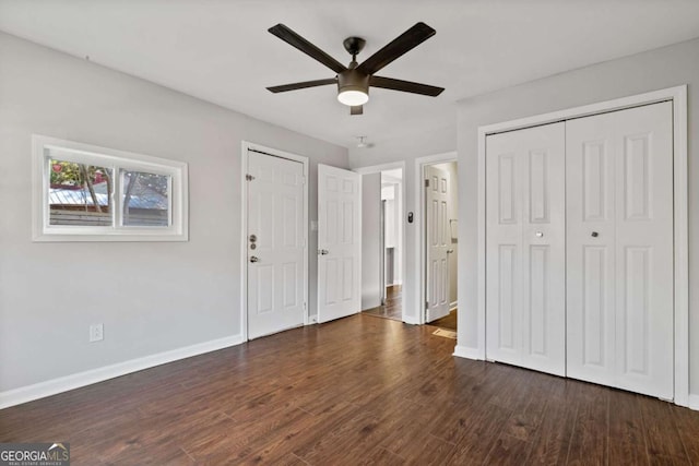 unfurnished bedroom featuring dark hardwood / wood-style floors and ceiling fan