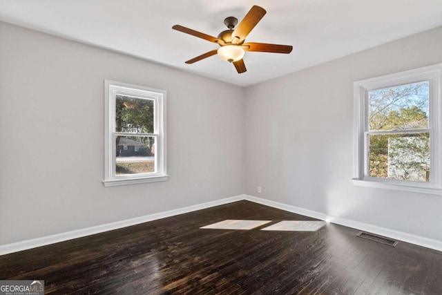 spare room featuring ceiling fan and hardwood / wood-style floors