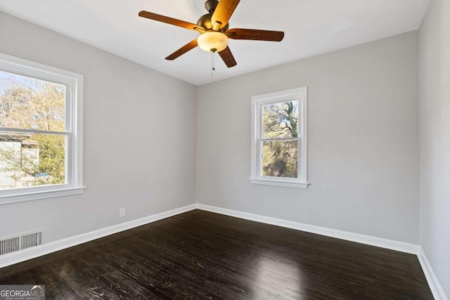 unfurnished room with hardwood / wood-style flooring, plenty of natural light, and ceiling fan