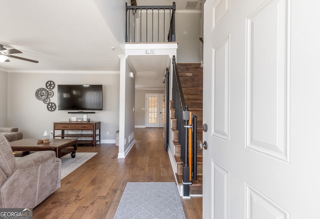 living room featuring crown molding, ceiling fan, and hardwood / wood-style floors