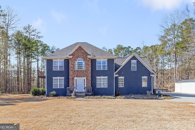 colonial home with a front yard