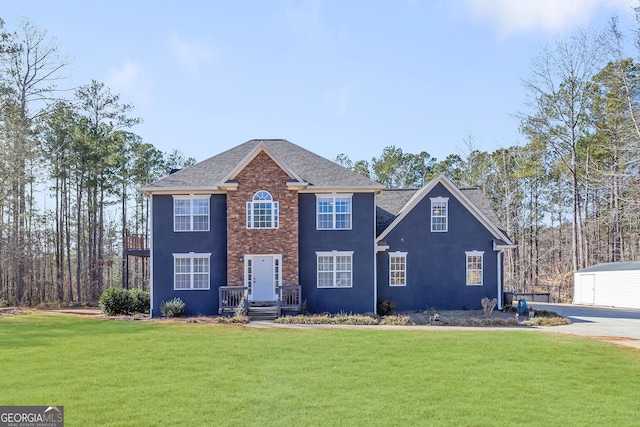 view of front of home with a front lawn