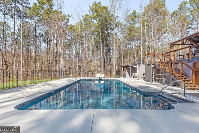 view of swimming pool with a patio