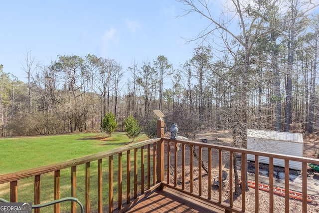 wooden deck with a lawn