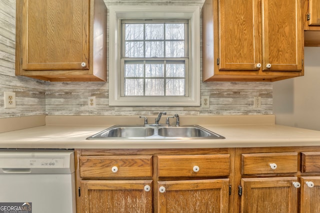 kitchen with tasteful backsplash, sink, and dishwasher