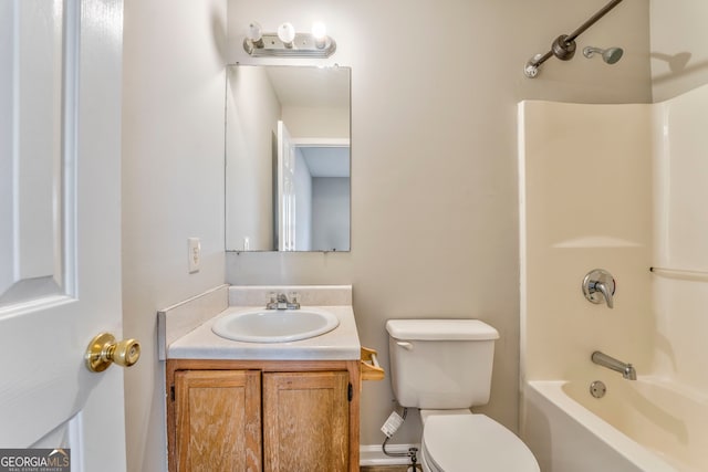 full bathroom featuring toilet, vanity, and bathtub / shower combination