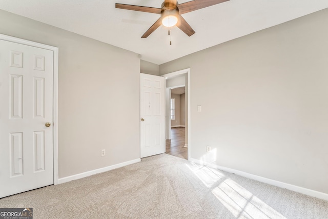 unfurnished bedroom with light carpet