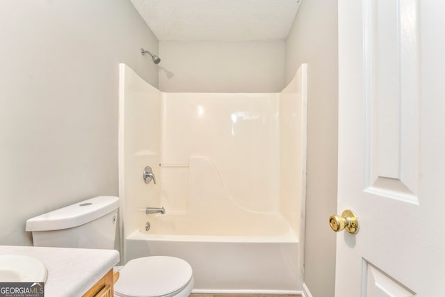 full bathroom with vanity, toilet, shower / bath combination, and a textured ceiling