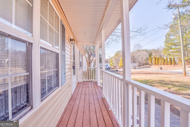 wooden terrace featuring a porch