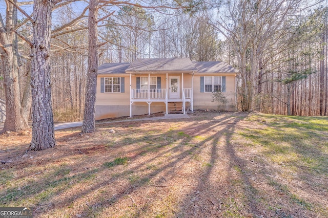 ranch-style home with a front lawn and a porch