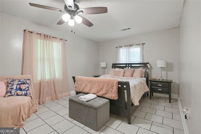 bedroom featuring ceiling fan and light tile patterned flooring