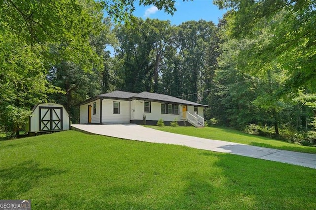 view of front facade featuring a storage unit and a front lawn