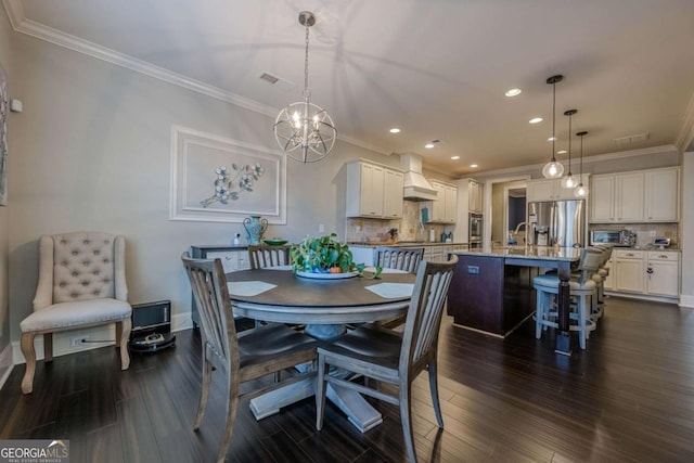 dining area with crown molding, dark hardwood / wood-style flooring, and sink