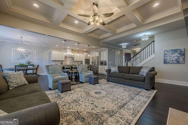 living room with dark hardwood / wood-style floors, crown molding, coffered ceiling, and beam ceiling