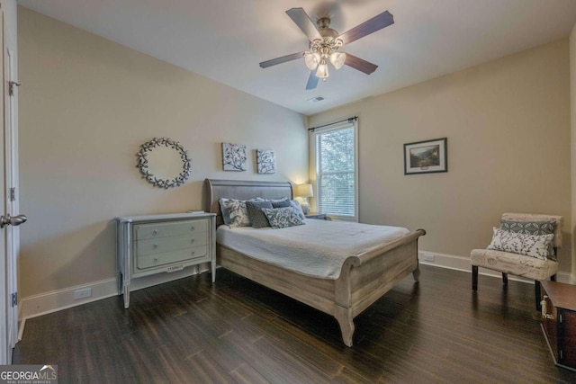 bedroom with ceiling fan and dark hardwood / wood-style flooring