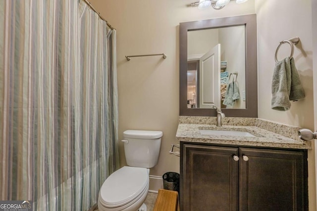 bathroom with vanity, toilet, and a shower with shower curtain