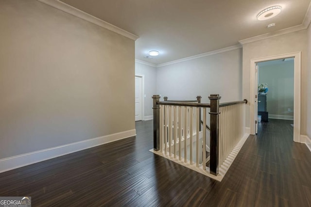 corridor with ornamental molding and dark hardwood / wood-style floors