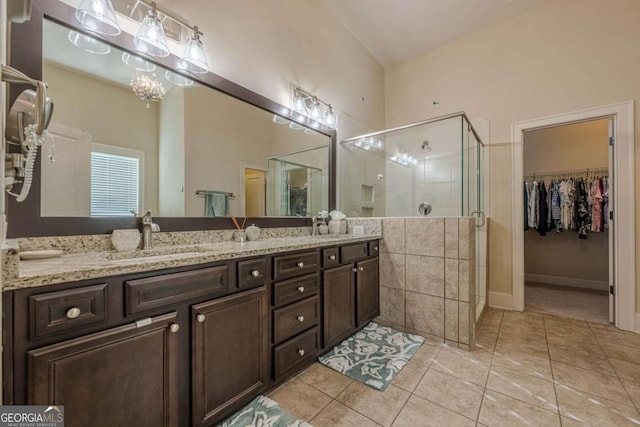 bathroom with vanity, tile patterned floors, and walk in shower