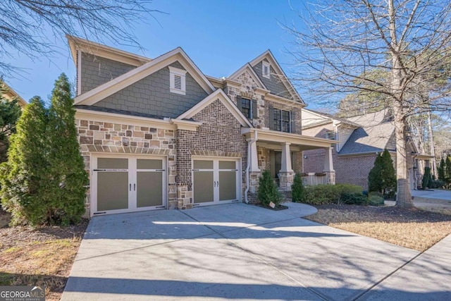 craftsman-style home featuring a garage and covered porch