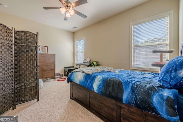 carpeted bedroom with ceiling fan