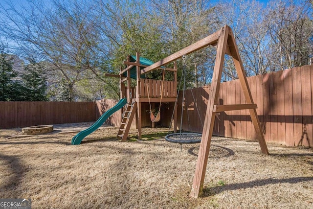 view of jungle gym featuring a fire pit